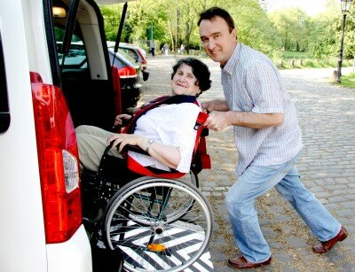 assisting-senior-with wheelchair